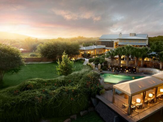 swimming pool at sunset outside of lake austin all inclusive in texas