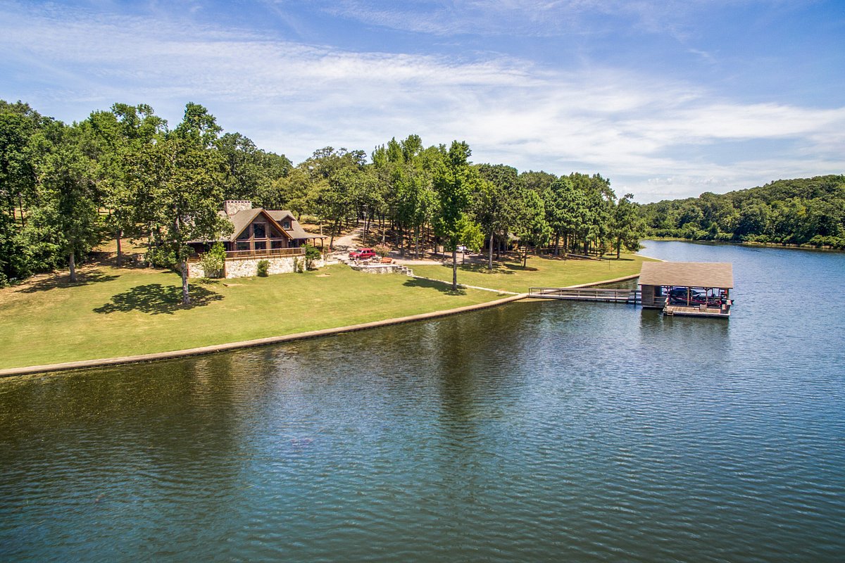 Large lodge with a boat ramp on a lake on a green island. One of the all-inclusive resorts in the south.