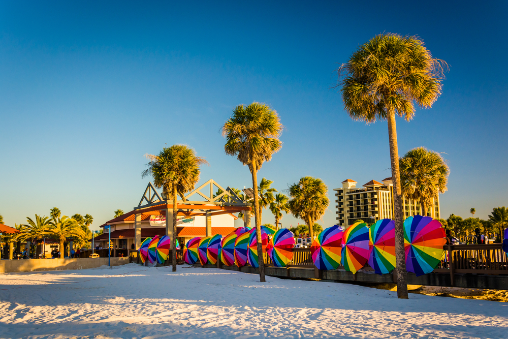 On clearwater beach-- one of the best beaches in Tampa-- has rainbow umbrellas and tall palm trees, white sand and big hotels. 