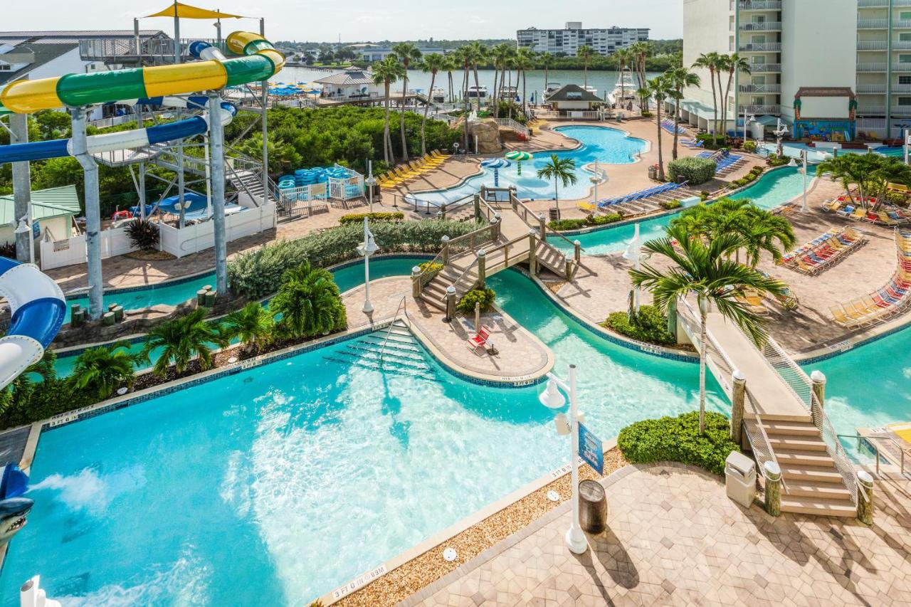 a view of one of the best Florida resorts with water parks where you see a pool,  and splash harbor water park in the background with the intercoastal in foreground