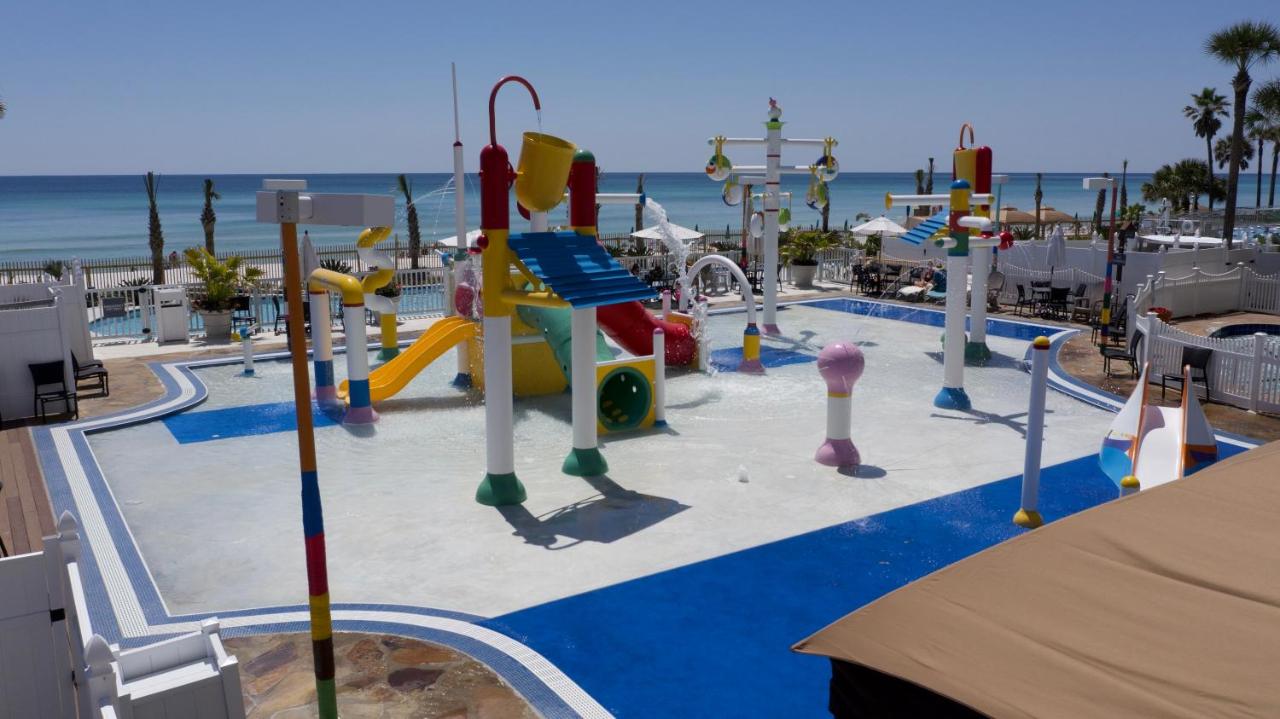 A kids water park with play structure slides and more overlooking the gulf coast at the Holiday Inn one of the best Florida resorts with water parks