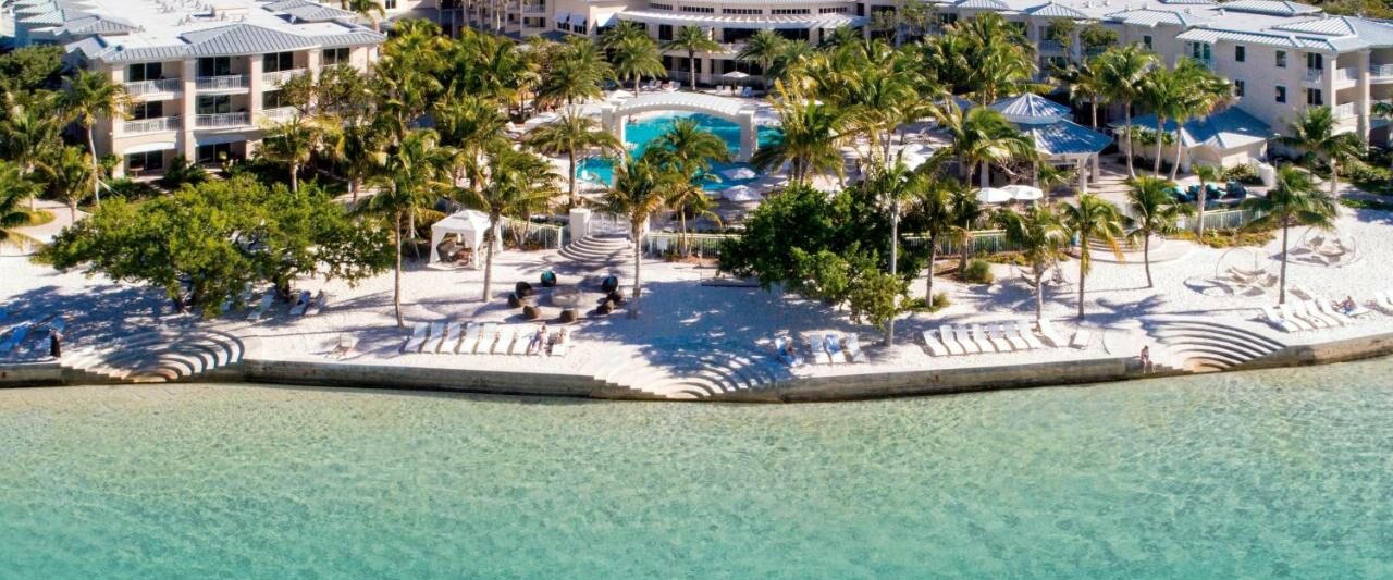 the playa largo resort and spa in the Florida Keys. it is right on the beach front with beautiful clear waters, plenty of palm trees, and lounge chairs in the back