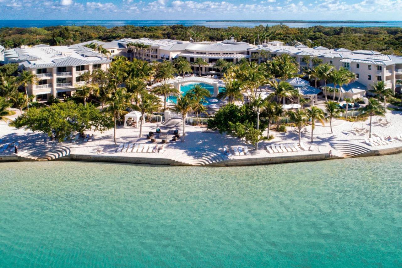 the playa largo resort and spa in the Florida Keys. it is right on the beach front with beautiful clear waters, plenty of palm trees, and lounge chairs in the back 