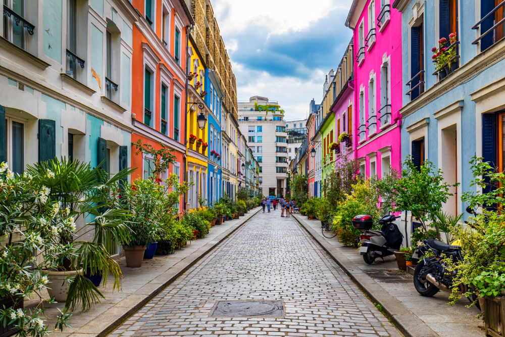 Rue Cremieux in the 12th Arrondissement is one of the prettiest residential streets in Paris. Colored houses in Rue Cremieux street in Paris. France.