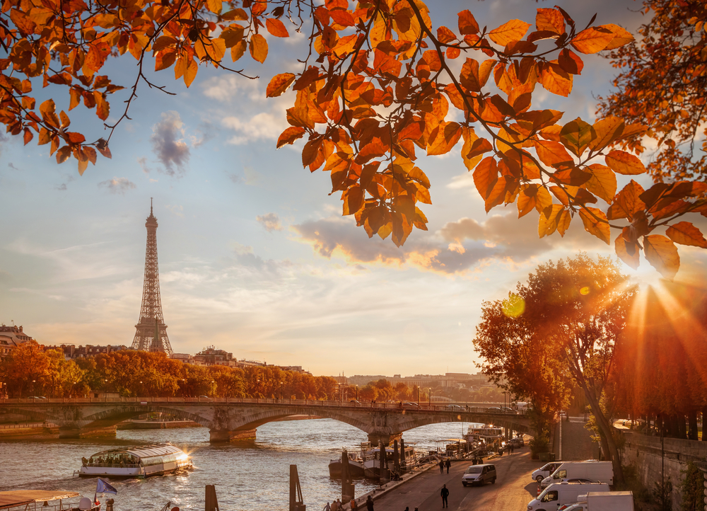 Eifel Tower in Paris with fall leaves surrounding it during the best time to visit Paris