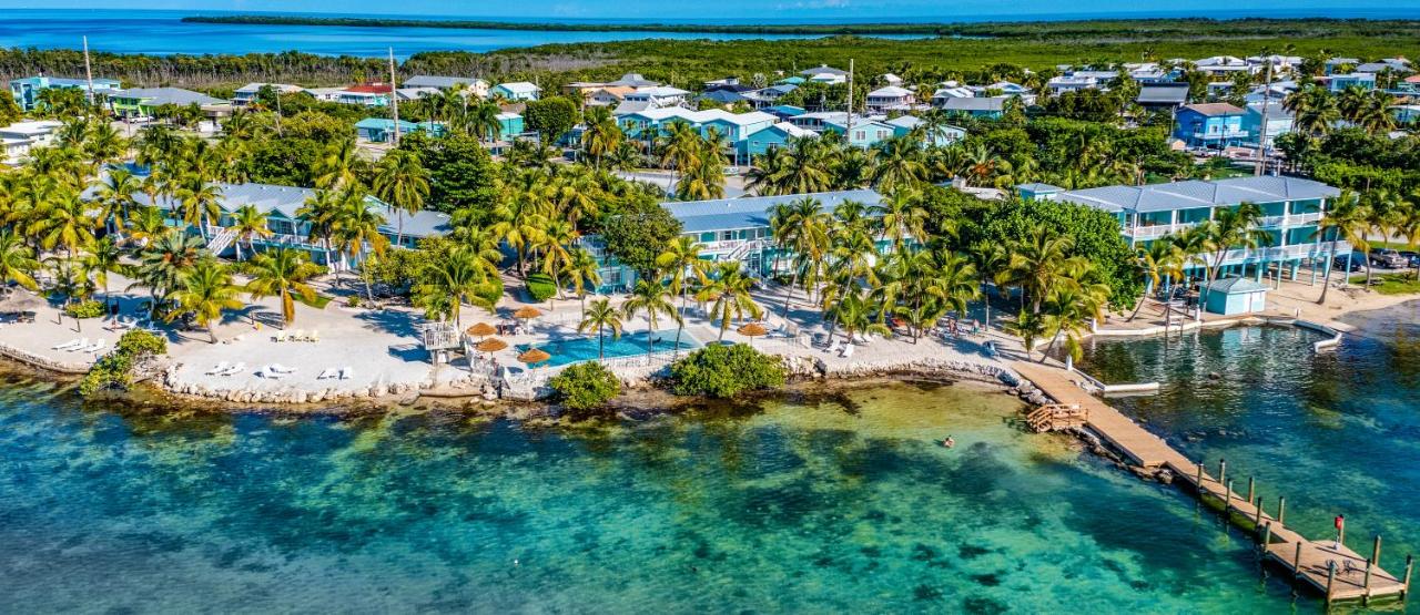 one of the best florida key resorts on the bay with a long pier, white sand, and beautiful sea waters 