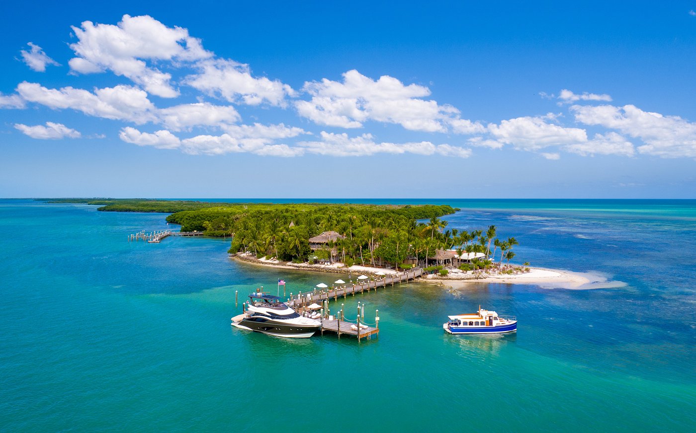 the lovely island that the little island palm resort in the Florida Keys. with crystal clear waters and a long boat dock. 