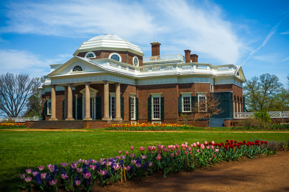 the beautiful Monticello home in virginia. this is a historic brick building with beautiful tulips out front.