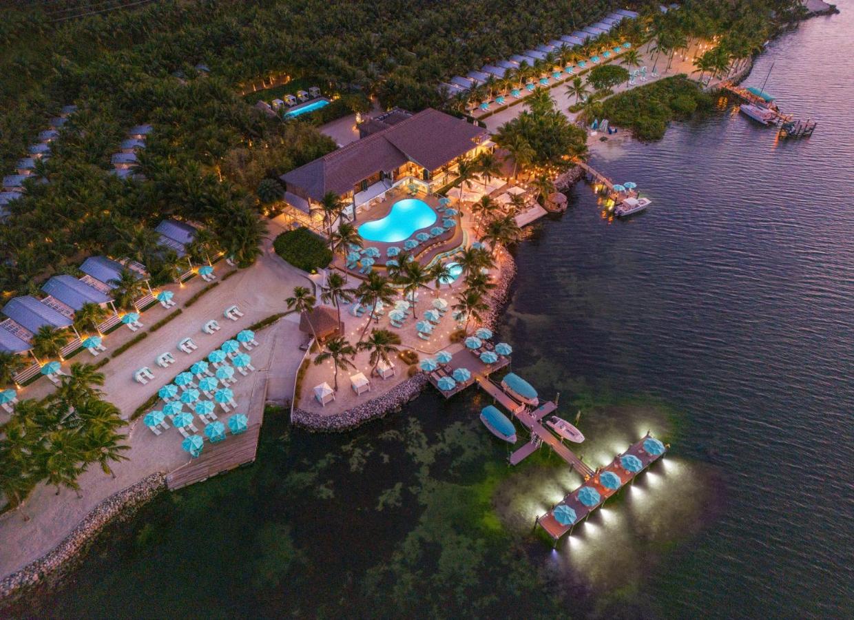 An Ariel show shows the decks and resort of an all incisive in Florida. The pool, private beaches, and stunning private bungalows are to die for.