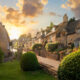 sunset over beautiful houses in the cotswolds in england