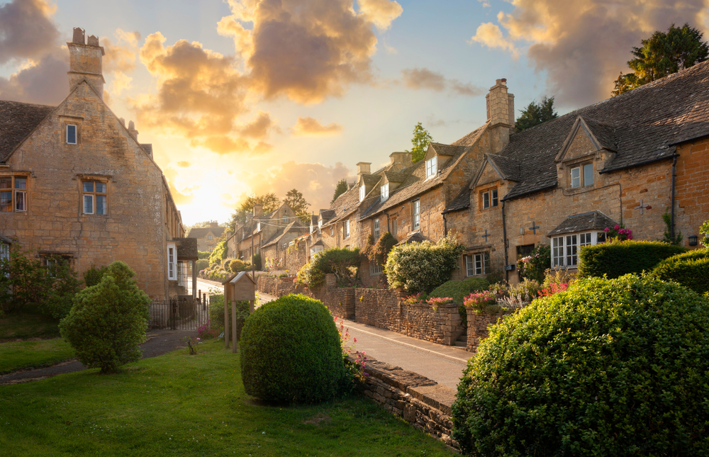 A village in the Cotswolds showing cottages lining the streets.One of the best places to visit in the Cotswolds 