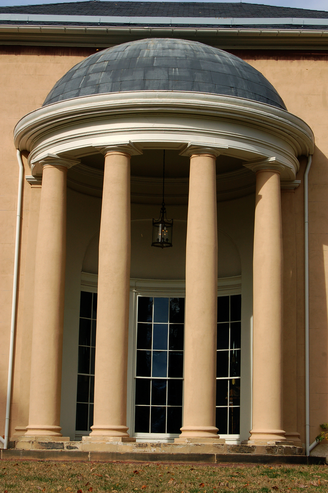 image of the beautiful and elaborate from steps with amazing, large columns decorating the Tudor Place, one of the best things to do in Georgetown!