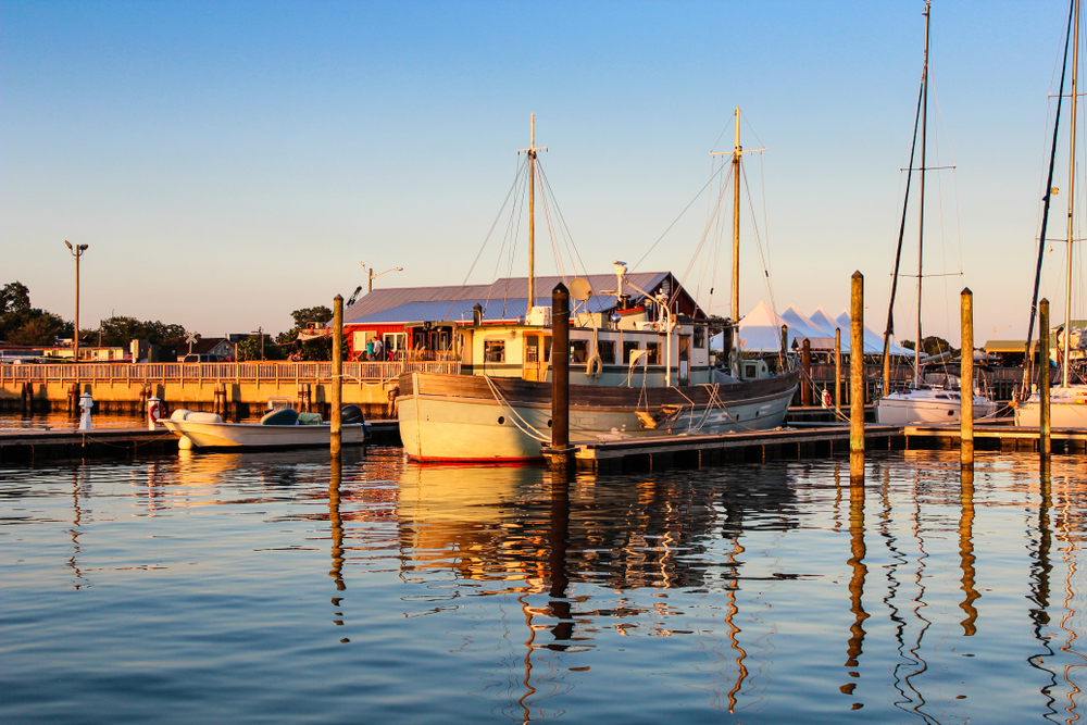 the beautiful cape Charles marina at sunset you can see boats and the sunsetting perfectly 