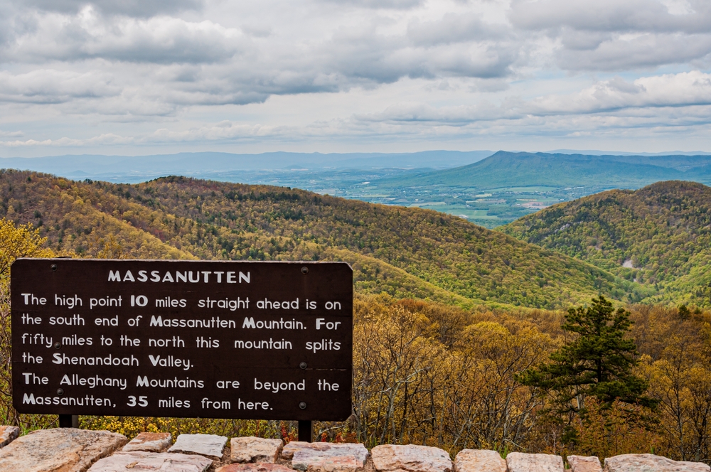 the view from the massanutten hike saying the high point is about 110 miles ahead with blue sky and white clouds