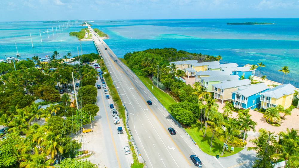 An aerial view of the road leading to and from Key West with bridges across the ocean