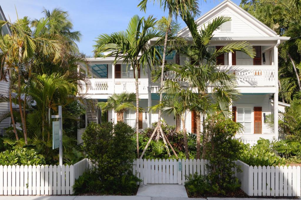 The front of a two story bungalow that you can rent in Key West