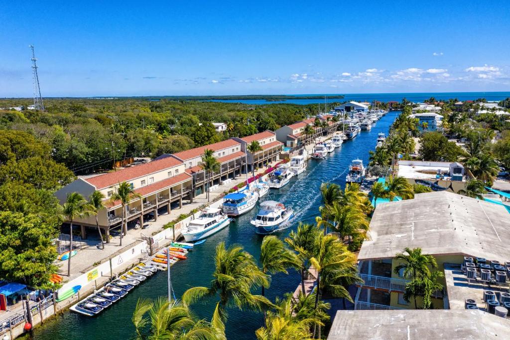 The view from a hotel in Key Largo of a riverway, marina, and other buildings. 