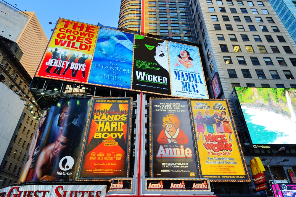 8 broadway sign shows in the center of NYC they are showing Jersey boys,  phantom of the opera, wicked, mamma Mia, lifetime, hands of hard body, Anne, and nice work 