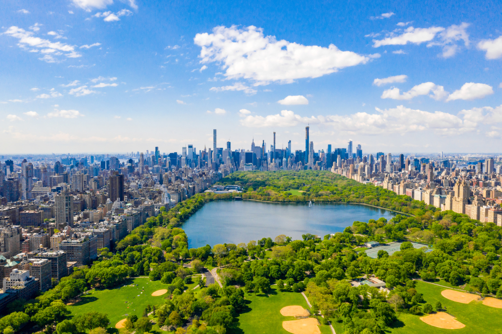 the lovely view of Central Park from above with a big lake, plenty of green spaces all in the center of Manhattan NY. visiting here during your weekend in NYC is a great stop