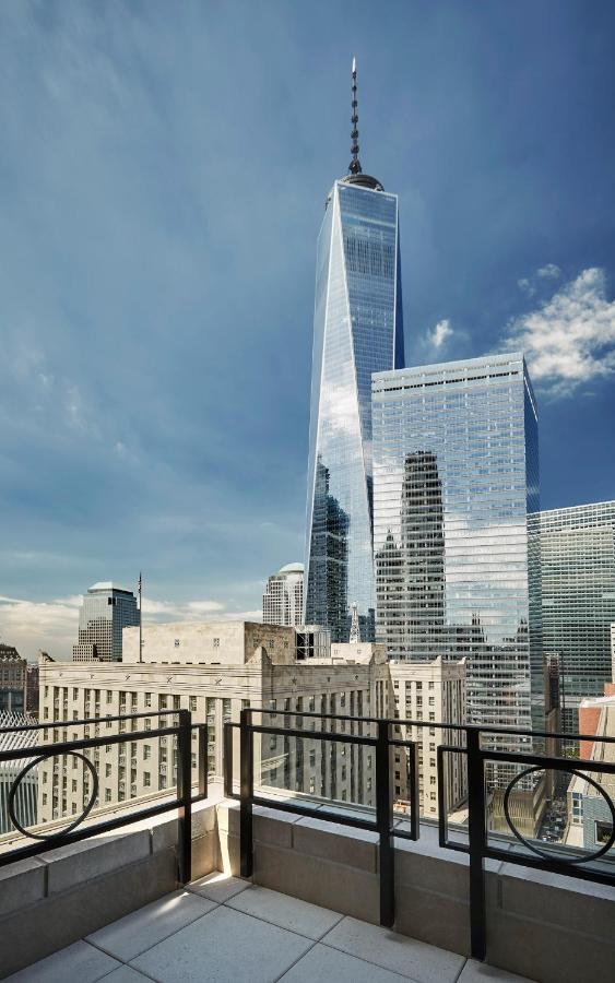 the view from one of the rooms at the four seasons New York downtown hotel. you can see the Empire State buildings as well as a view sky scrapers 