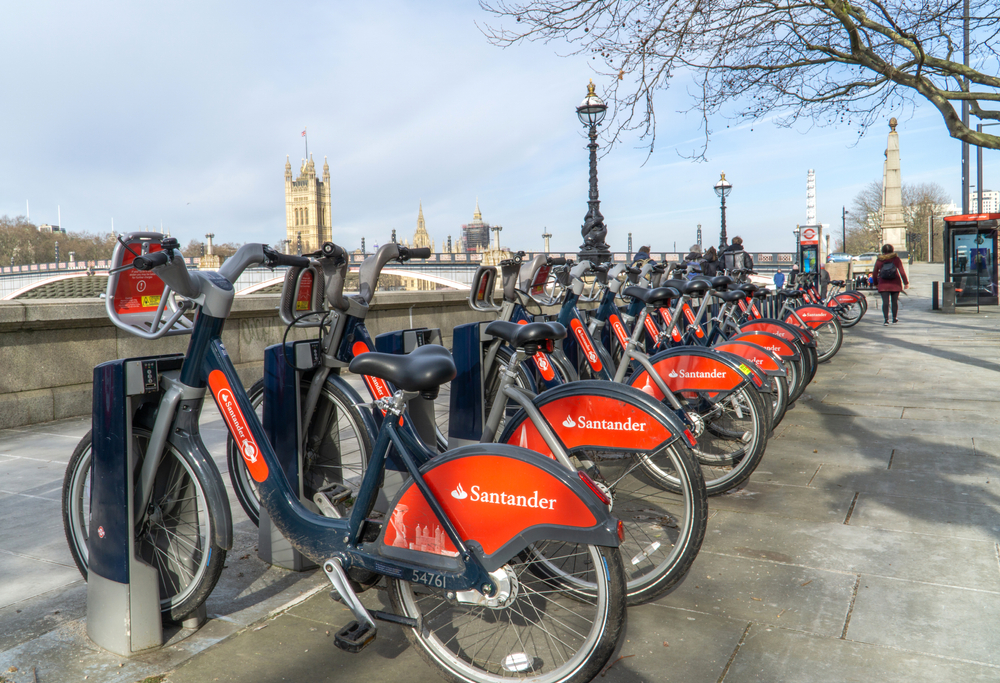 Row of docked bikes next to the river in London.