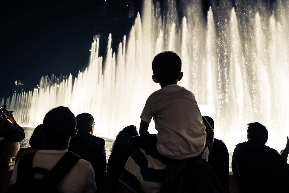 the silhouette of people watching the fountain show at the Bellagio Resort during a weekend in Las Vegas