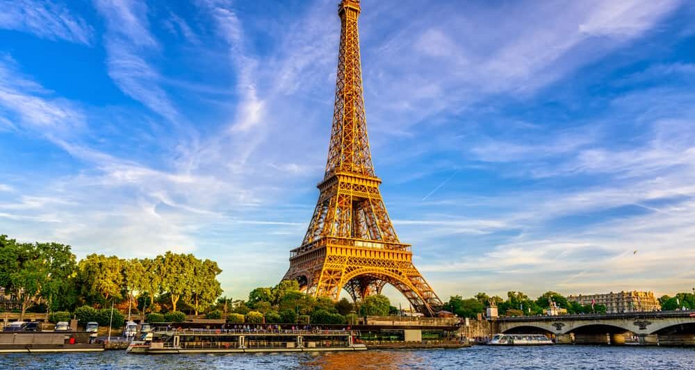 photo of the eiffel tower with blue sunset in the background