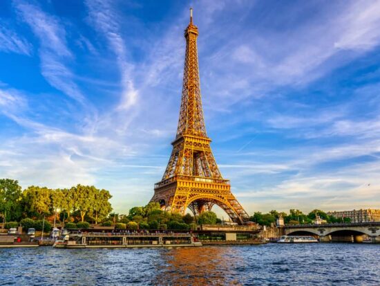 photo of the eiffel tower with blue sunset in the background