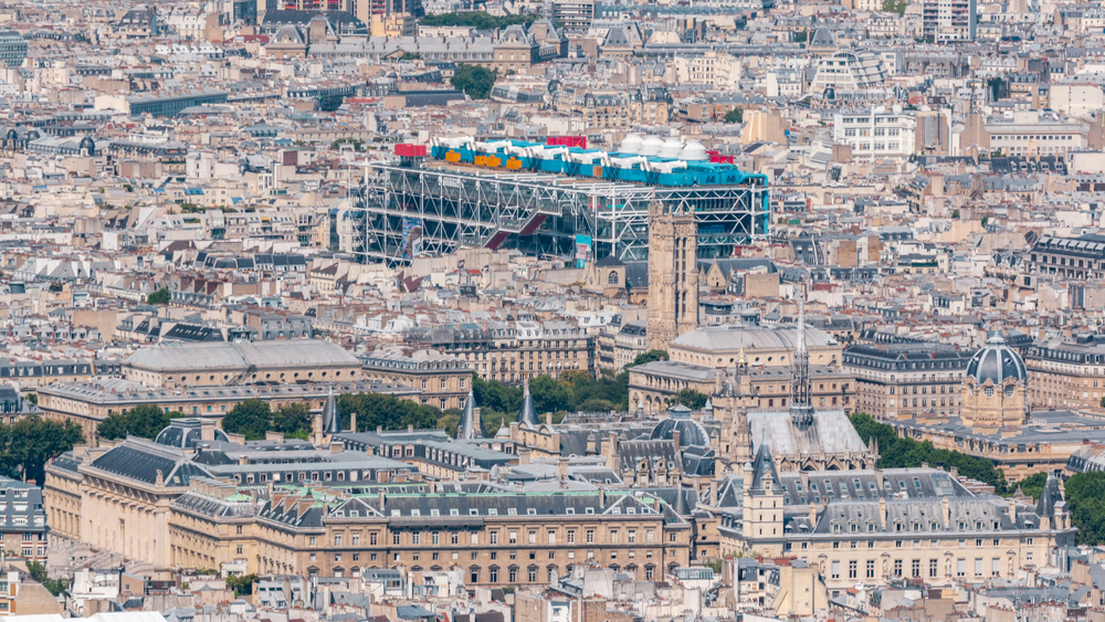 The Pompidou Center, is a stark contrast with its metal and colorful tubes surrounded by the iconic architecture of Paris
