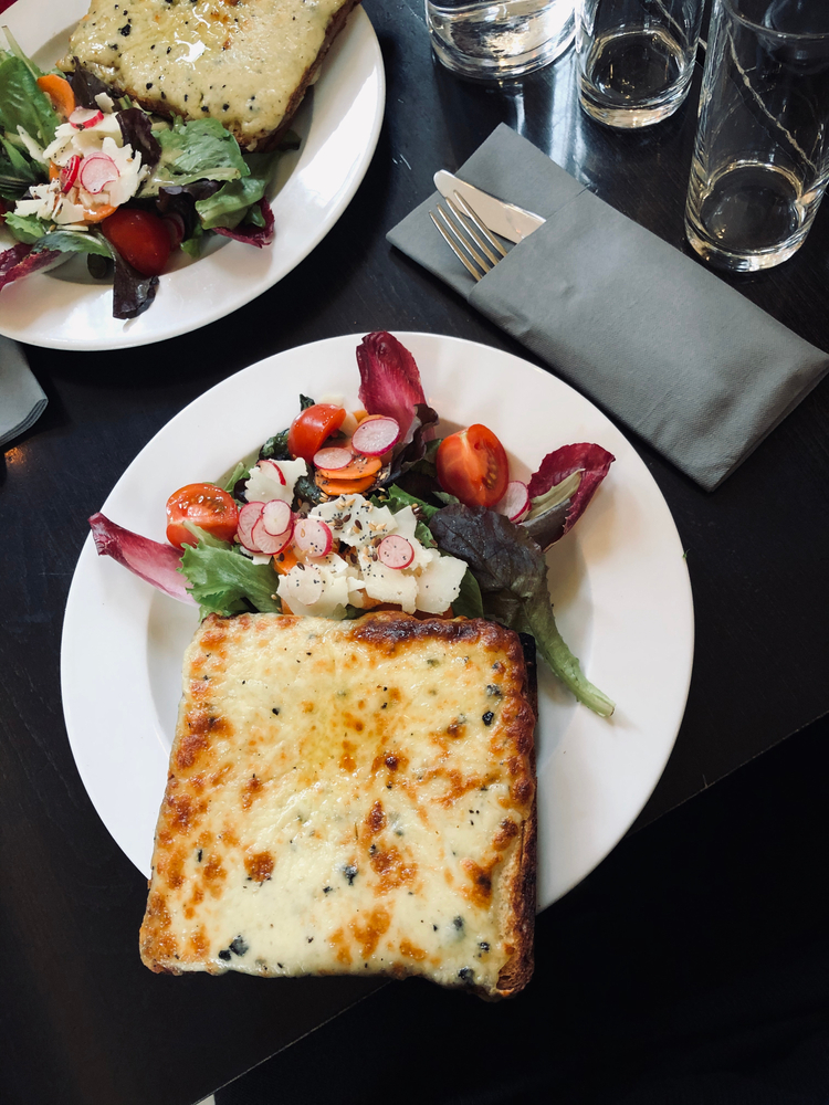lunch in Paris, croque monsios toasted with a salad on a cafe in Marrais