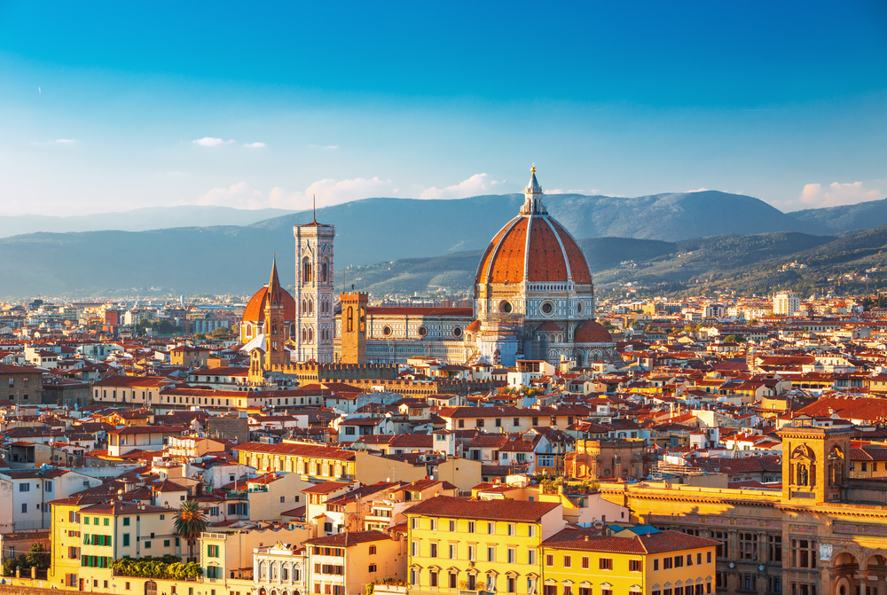Golden hour over the rooftops of Florence featuring the Duomo church during 10 days in Italy itinerary.