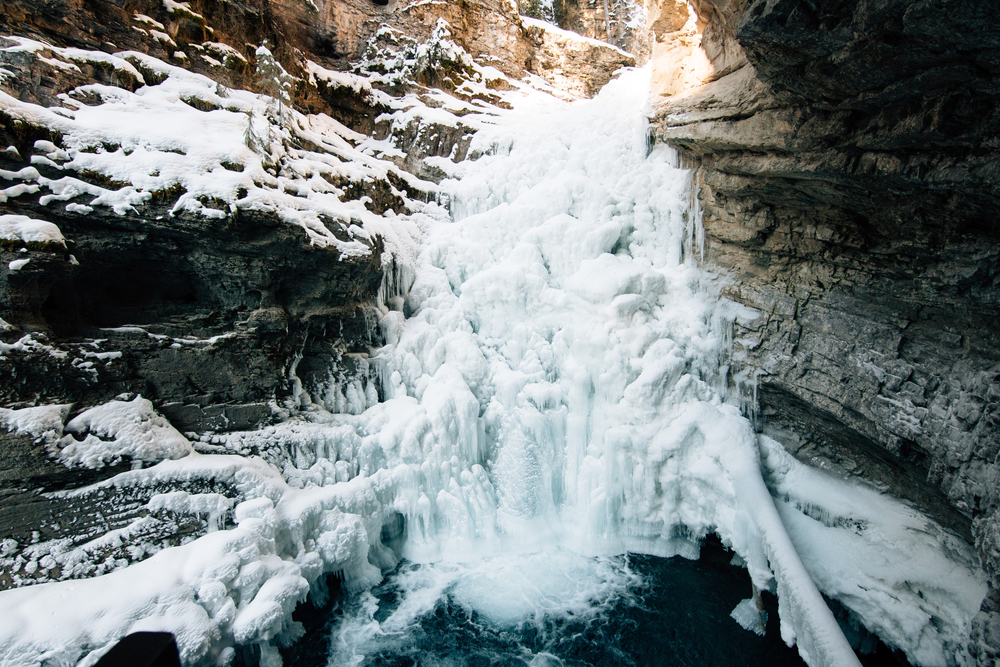 Beautiful frozen waterfall in a rugged canyon.