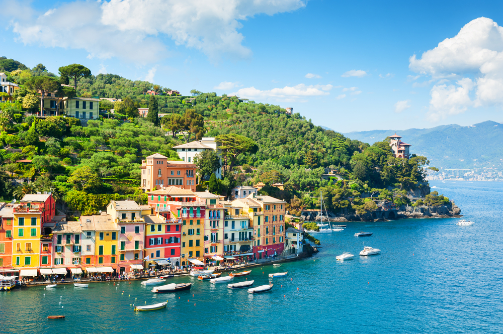 Aerial view of Portofino on the Ligurian Coast with boats and colorful houses.