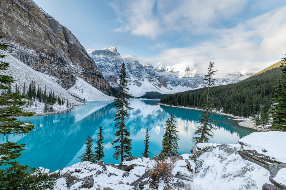 Overlooking Moraine Lake nestled among mountains on a snowy day.