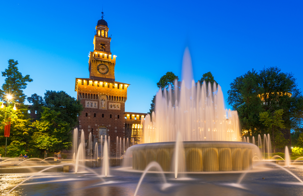 Long exposure dusk photo of a fountain in front of the Sforza Castle during 10 days in Italy itinerary.