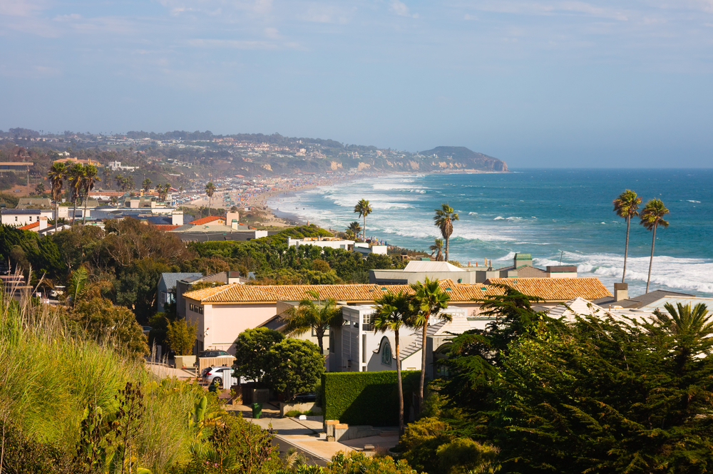 view of the houses on Malibu beach with the ocean in the background.  