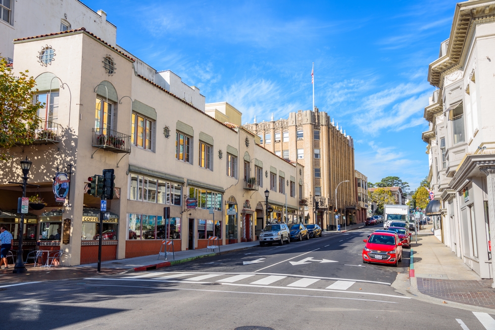 View of Franklin Street in Historic downtown Monterey on a sunny morning. There are buildings down each side.  