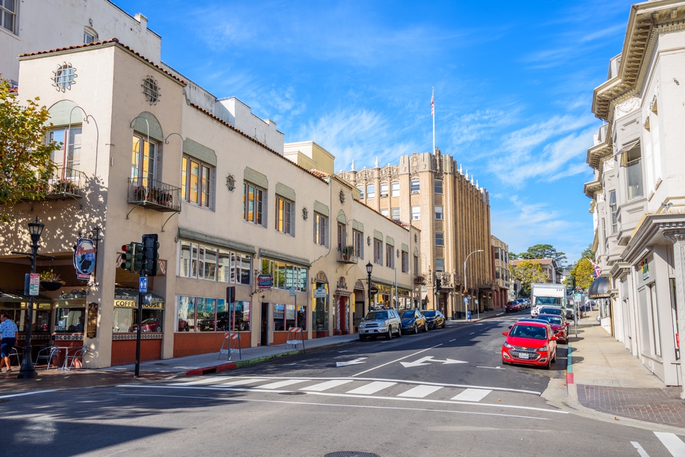 View of Franklin Street in Historic downtown Monterey on a sunny morning. There are buildings down each side.