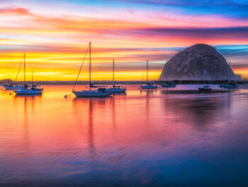 ojai harbor during sunset with rock and boats