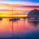 ojai harbor during sunset with rock and boats