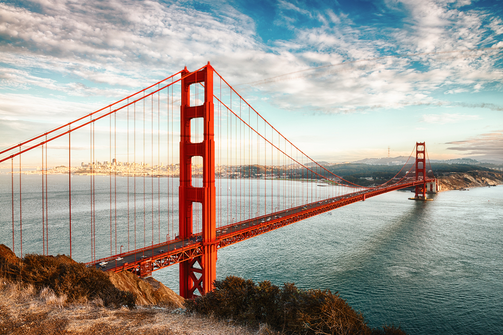 The Golden Gate Bridge with the city in the distance in an article about San Francisco to Los Angeles Road Trip