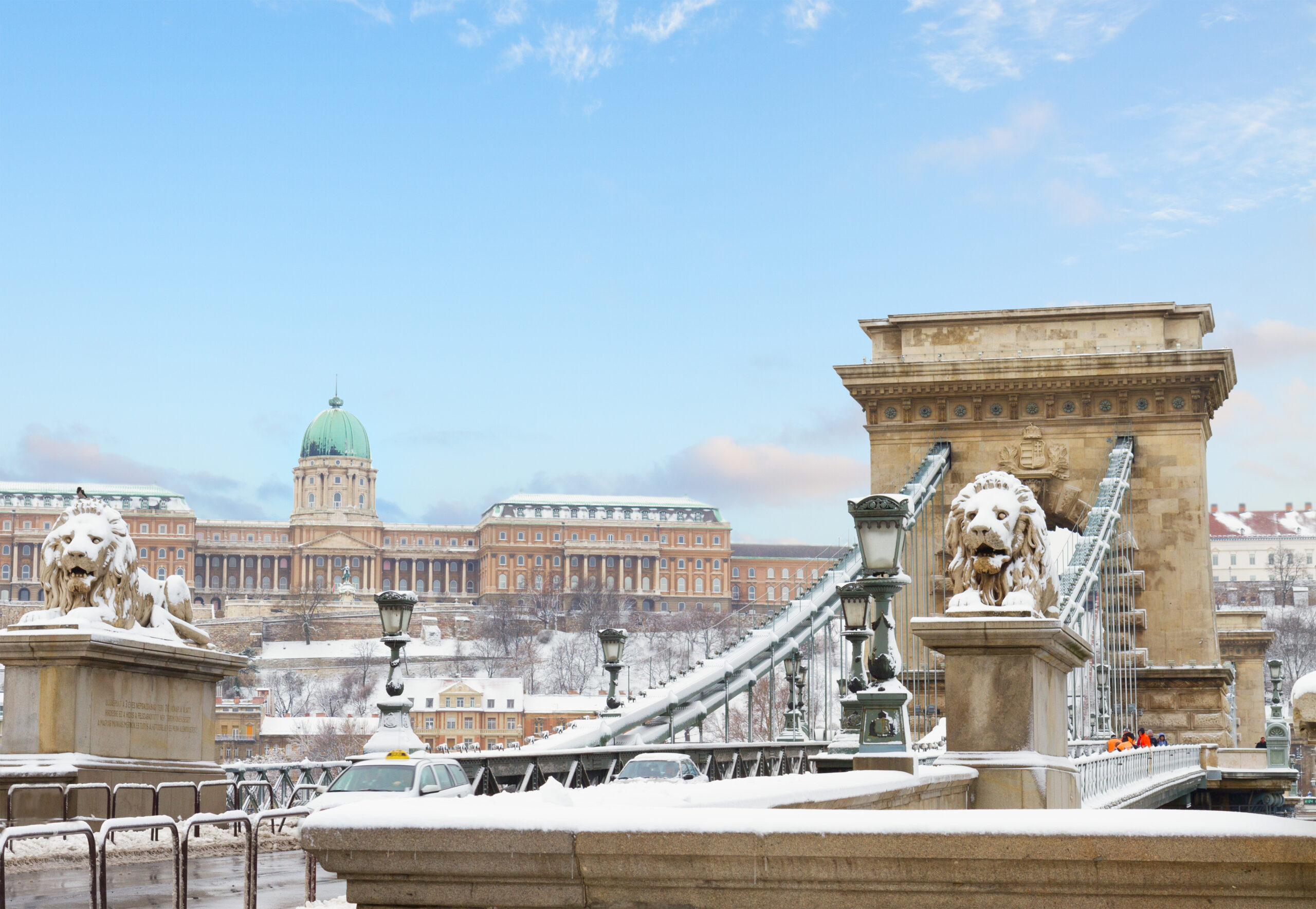 Beautiful photo of a dusting of snow on the bridge during winter in Budapest