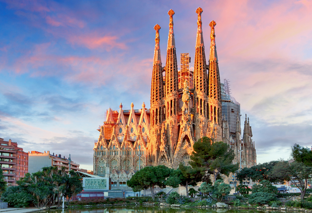 Sunset over La Sagrada Familia with its many towers in Barcelona during one week in Europe.