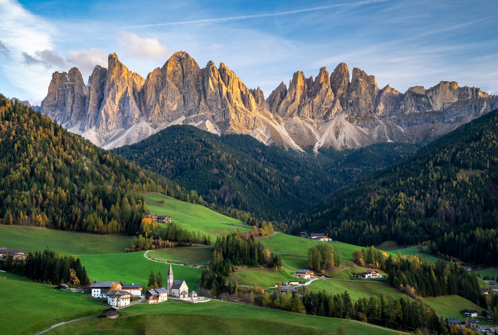 View of the rugged Dolomites with a small village nestled in the valley.