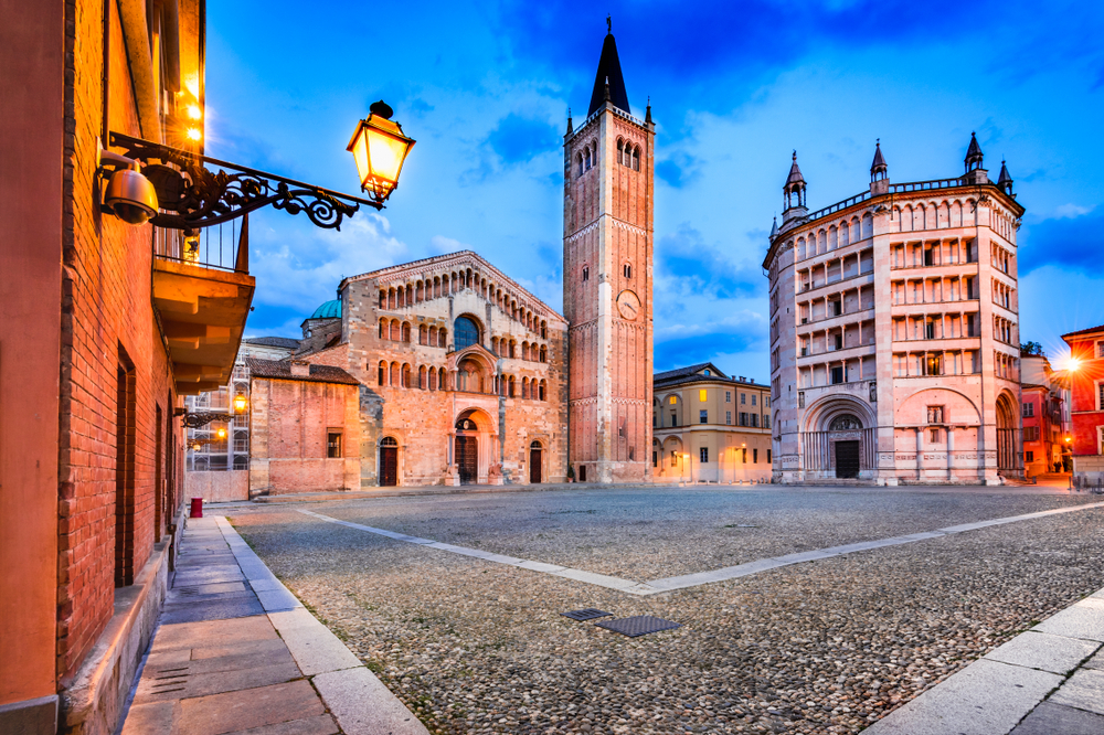 Dusk at a square with a church in Parma, Italy.