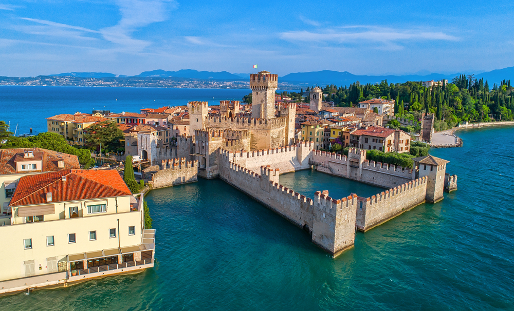 Aerial view of Scaligero Castle on the water on a Northern Italy Itinerary.