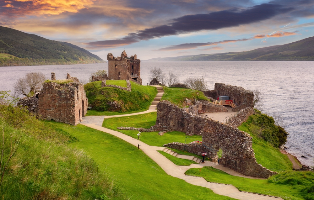 The ruins of Urquhart Castle overlooking Loch Ness at sunset during one week in Europe.