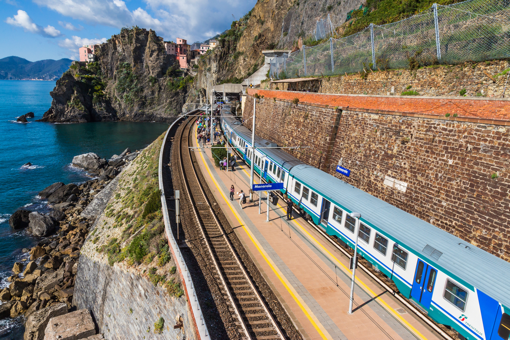 Looking down at the train station along a cliff in Cinque Terre.