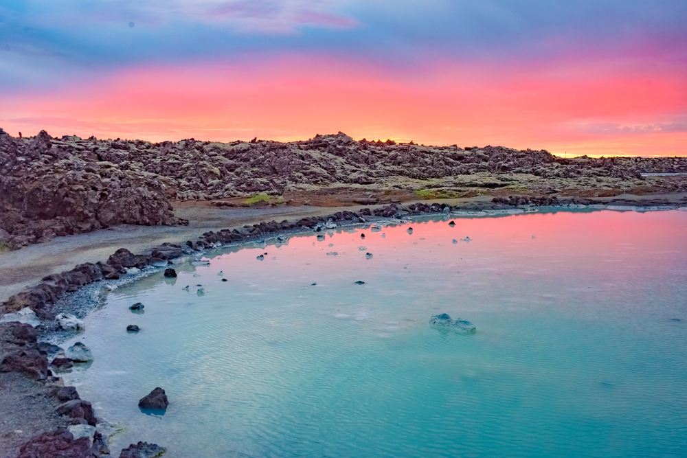 the midnight sun in Ireland during the summer. the sky is a mix of blues, pinks, and oranges. 