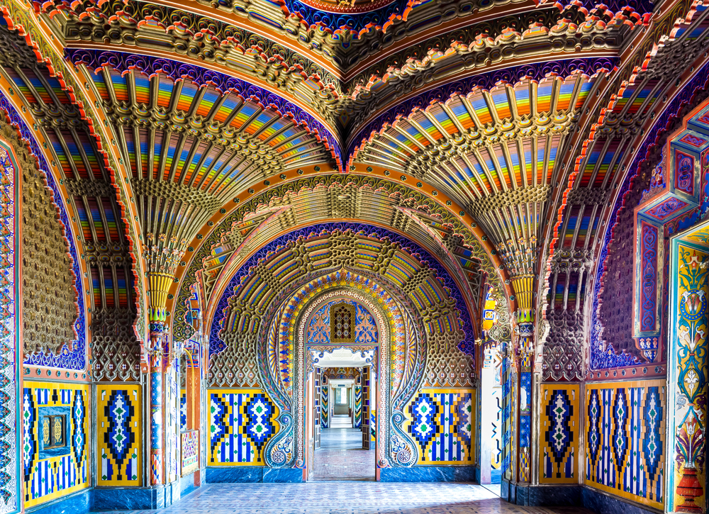 The colorful peacock room in Sammezzano Castle. It's an array of bright colors especially blue and has arches. 